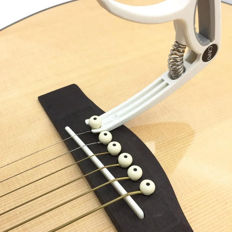 Plastic Guitar Capo for 6 Stri - Musical Instrument Names recension och pris